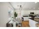 Bright eat-in kitchen with white cabinets and a farmhouse table at 1409 E Harvest Rd, San Tan Valley, AZ 85140