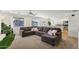 Open concept living room and kitchen with sectional sofa at 1409 E Harvest Rd, San Tan Valley, AZ 85140