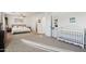 Main bedroom with king bed, crib, and lots of light at 1409 E Harvest Rd, San Tan Valley, AZ 85140