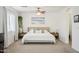 Primary bedroom with king bed and calming ocean art at 1409 E Harvest Rd, San Tan Valley, AZ 85140