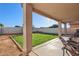 Covered patio overlooking backyard at 1409 E Harvest Rd, San Tan Valley, AZ 85140