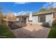 Backyard patio area with hot tub and umbrella at 1427 E Irwin Ave, Phoenix, AZ 85042