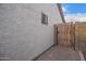 Wooden gate and brick pathway in backyard at 1427 E Irwin Ave, Phoenix, AZ 85042