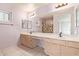 Double vanity bathroom with updated fixtures and a walk-in shower at 1427 E Irwin Ave, Phoenix, AZ 85042