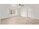 Bright bedroom with laminate wood floor and ceiling fan at 1427 E Irwin Ave, Phoenix, AZ 85042