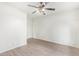 Simple bedroom with light walls and wood-look flooring at 1427 E Irwin Ave, Phoenix, AZ 85042