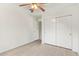 Well-lit bedroom with wood-look floors and double door closet at 1427 E Irwin Ave, Phoenix, AZ 85042
