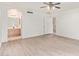 Bedroom with new wood-look flooring and an ensuite bathroom at 1427 E Irwin Ave, Phoenix, AZ 85042