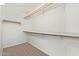 Large walk-in closet with shelving and hanging rods at 1427 E Irwin Ave, Phoenix, AZ 85042