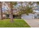 House exterior features a gray color scheme, a two-car garage, and a well-maintained lawn at 1427 E Irwin Ave, Phoenix, AZ 85042