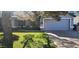 Ranch style home with gray exterior, attached garage, and well-manicured lawn at 1427 E Irwin Ave, Phoenix, AZ 85042