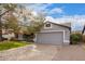 House front with gray garage door and landscaping at 1427 E Irwin Ave, Phoenix, AZ 85042