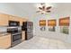 Modern kitchen, stainless steel appliances, and wood cabinets at 1427 E Irwin Ave, Phoenix, AZ 85042