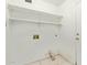 Laundry room with built-in shelving and hookups at 1427 E Irwin Ave, Phoenix, AZ 85042