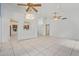 Spacious living area with tile floors and a view into the kitchen at 1427 E Irwin Ave, Phoenix, AZ 85042