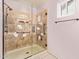 Walk-in shower with glass enclosure and decorative tile accents at 1427 E Irwin Ave, Phoenix, AZ 85042