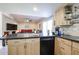 Kitchen features island with black countertop at 14851 N 25Th Dr # 21, Phoenix, AZ 85023