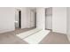Bedroom with double door closet and neutral carpeting at 17449 W El Caminito Dr, Waddell, AZ 85355