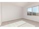 Spacious bedroom with neutral carpeting and window at 17449 W El Caminito Dr, Waddell, AZ 85355