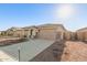 Single story home with attached garage and neutral color scheme at 17449 W El Caminito Dr, Waddell, AZ 85355