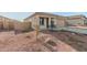 Single-story house with attached garage and rocky front yard at 17449 W El Caminito Dr, Waddell, AZ 85355