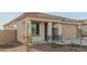 New construction home with neutral color palette and stone accents at 17449 W El Caminito Dr, Waddell, AZ 85355