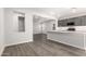 Modern kitchen with island, stainless steel appliances, and gray cabinets at 17449 W El Caminito Dr, Waddell, AZ 85355
