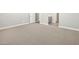 Bedroom featuring neutral carpet and a glimpse of the ensuite bathroom at 17636 W Pierson St, Goodyear, AZ 85395