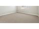 Bedroom featuring neutral carpet, white baseboards and a window for natural light at 17636 W Pierson St, Goodyear, AZ 85395