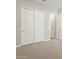 Spacious bedroom featuring sliding closet doors and neutral carpeting at 17636 W Pierson St, Goodyear, AZ 85395
