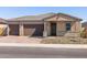 Inviting single-story home featuring a two-car garage and neutral color palette at 17636 W Pierson St, Goodyear, AZ 85395