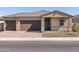 Charming single-story home with a two-car garage and a neatly paved driveway at 17636 W Pierson St, Goodyear, AZ 85395