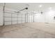 This is a three car garage with bright lighting and plenty of space for vehicles and storage at 17636 W Pierson St, Goodyear, AZ 85395