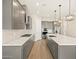 Spacious kitchen with gray cabinets, quartz countertops, and modern appliances at 17636 W Pierson St, Goodyear, AZ 85395