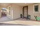 Inviting entryway with a modern door and decorative pots at 18388 W Larkspur Dr, Goodyear, AZ 85338