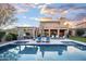 Resort-style backyard with a large pool and expansive patio at 18391 N 97Th Pl, Scottsdale, AZ 85255