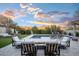 Stunning backyard with a sparkling pool, fire pit, and mountain views at 18391 N 97Th Pl, Scottsdale, AZ 85255