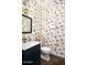 Charming powder room with bird wallpaper and marble vanity at 18391 N 97Th Pl, Scottsdale, AZ 85255