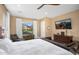 Main bedroom features a king bed, mountain views, and a built-in TV at 18391 N 97Th Pl, Scottsdale, AZ 85255