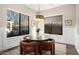 Charming breakfast nook with a round table and four cushioned chairs, offering ample natural light at 18391 N 97Th Pl, Scottsdale, AZ 85255