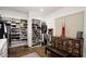 Large walk-in closet with ample shelving and hanging space for clothes and shoes at 18391 N 97Th Pl, Scottsdale, AZ 85255