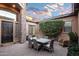 Charming courtyard with a dining table and comfortable seating at 18391 N 97Th Pl, Scottsdale, AZ 85255