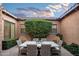 Inviting courtyard with seating area, lush greenery, and a relaxing atmosphere at 18391 N 97Th Pl, Scottsdale, AZ 85255