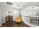 Elegant upstairs hallway with a comfortable seating area at 18391 N 97Th Pl, Scottsdale, AZ 85255