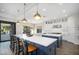 Gourmet kitchen boasts expansive island, stainless steel appliances, and stylish cabinetry at 18391 N 97Th Pl, Scottsdale, AZ 85255