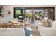 Bright living room showcasing a view and access to the backyard patio at 18391 N 97Th Pl, Scottsdale, AZ 85255