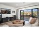 Living room with sliding doors leading to a balcony at 18391 N 97Th Pl, Scottsdale, AZ 85255