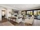 Open concept living room with hardwood floors and backyard access at 18391 N 97Th Pl, Scottsdale, AZ 85255