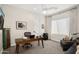 Home office with a large desk, comfortable chair, and natural light at 18391 N 97Th Pl, Scottsdale, AZ 85255