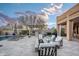Outdoor kitchen and fire pit area with pergola and seating at 18391 N 97Th Pl, Scottsdale, AZ 85255